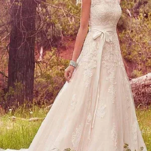 Bröllopsklänning i lantlig spets med kepsärmar | Vestido de Novia
